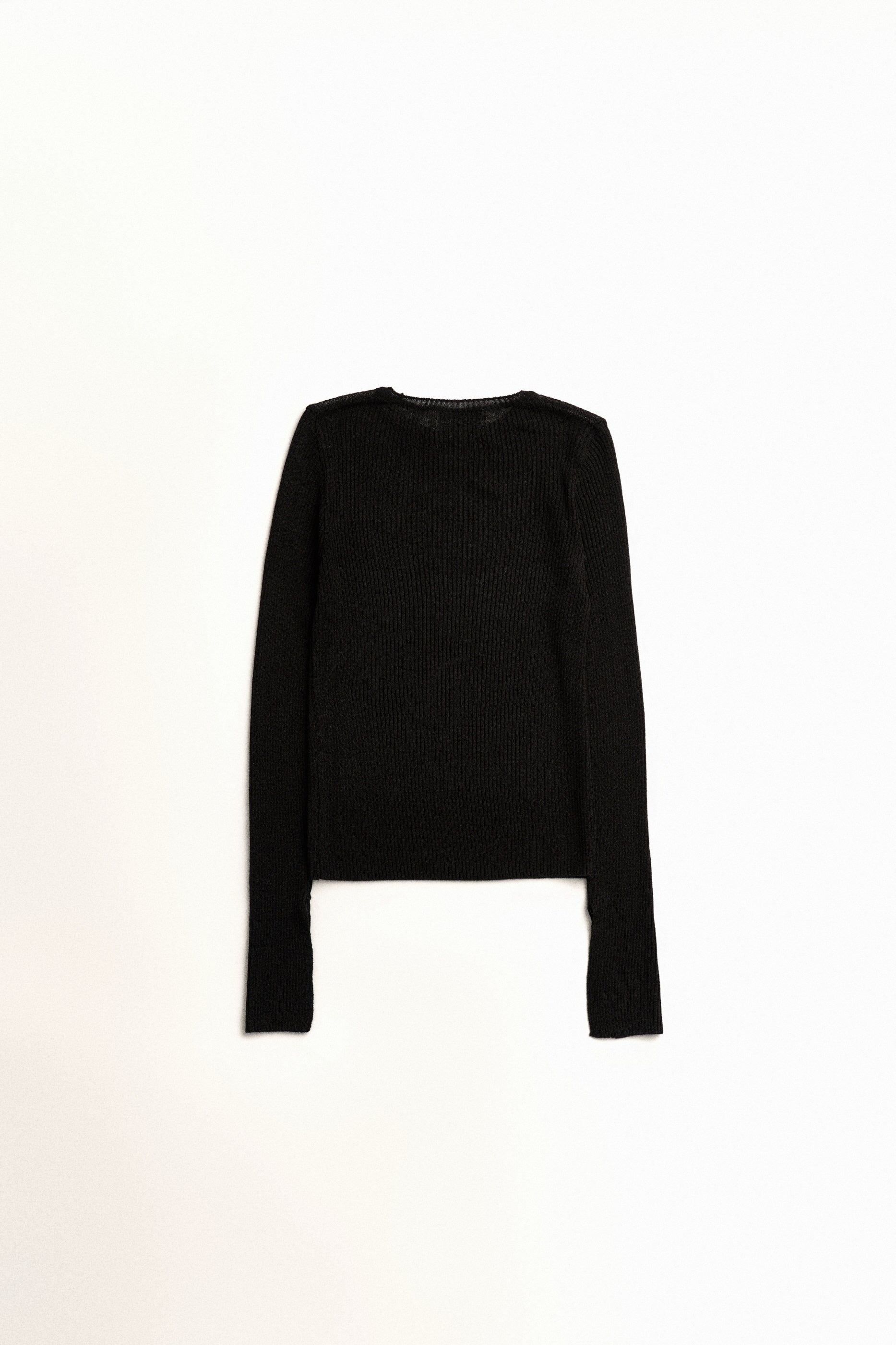 PULL TRANSPARANT À COUTURES BRUTES_NOIR